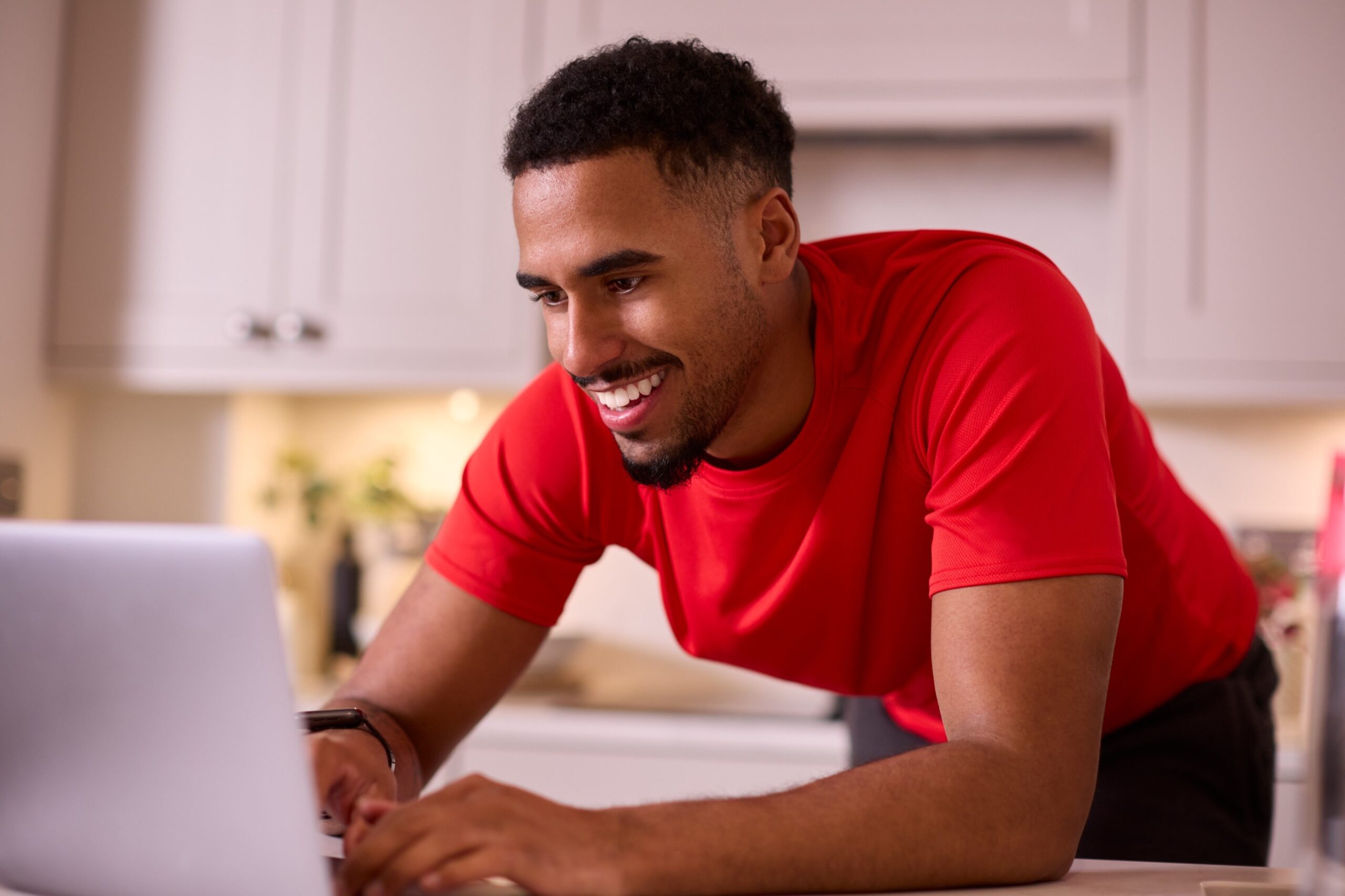 man-in-kitchen-at-home-wearing-fitness-clothing-wo-5ANGT5P-scaled.jpg